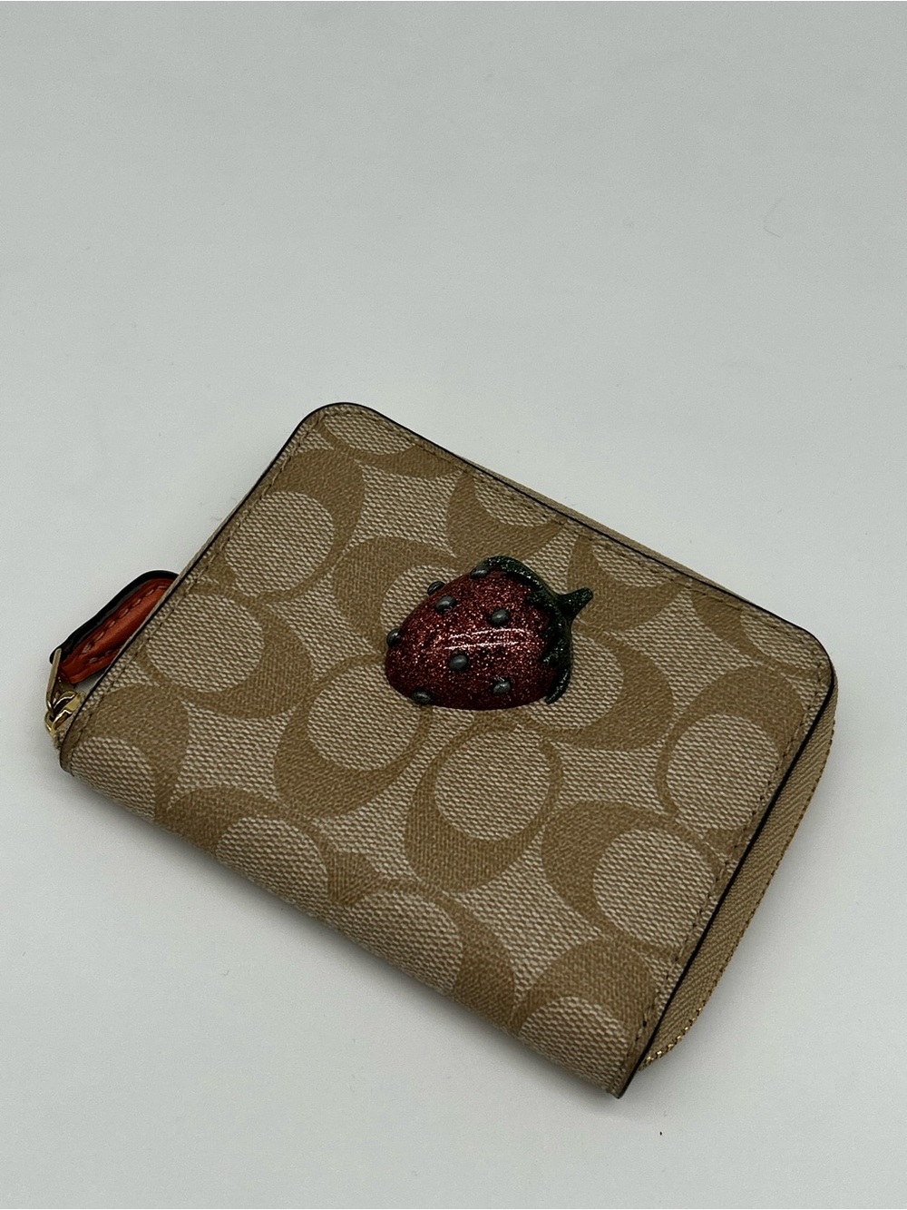 Coach Tan Signature Zip Card Case with Red Strawberry Accent